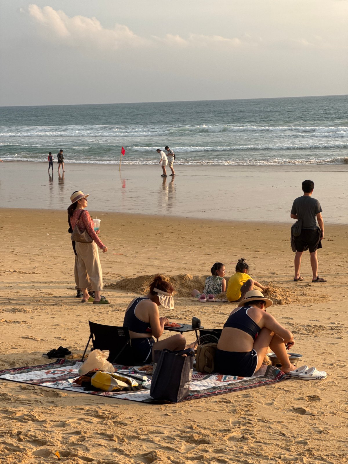 Karon Beach buzzing through a golden-hour afternoon