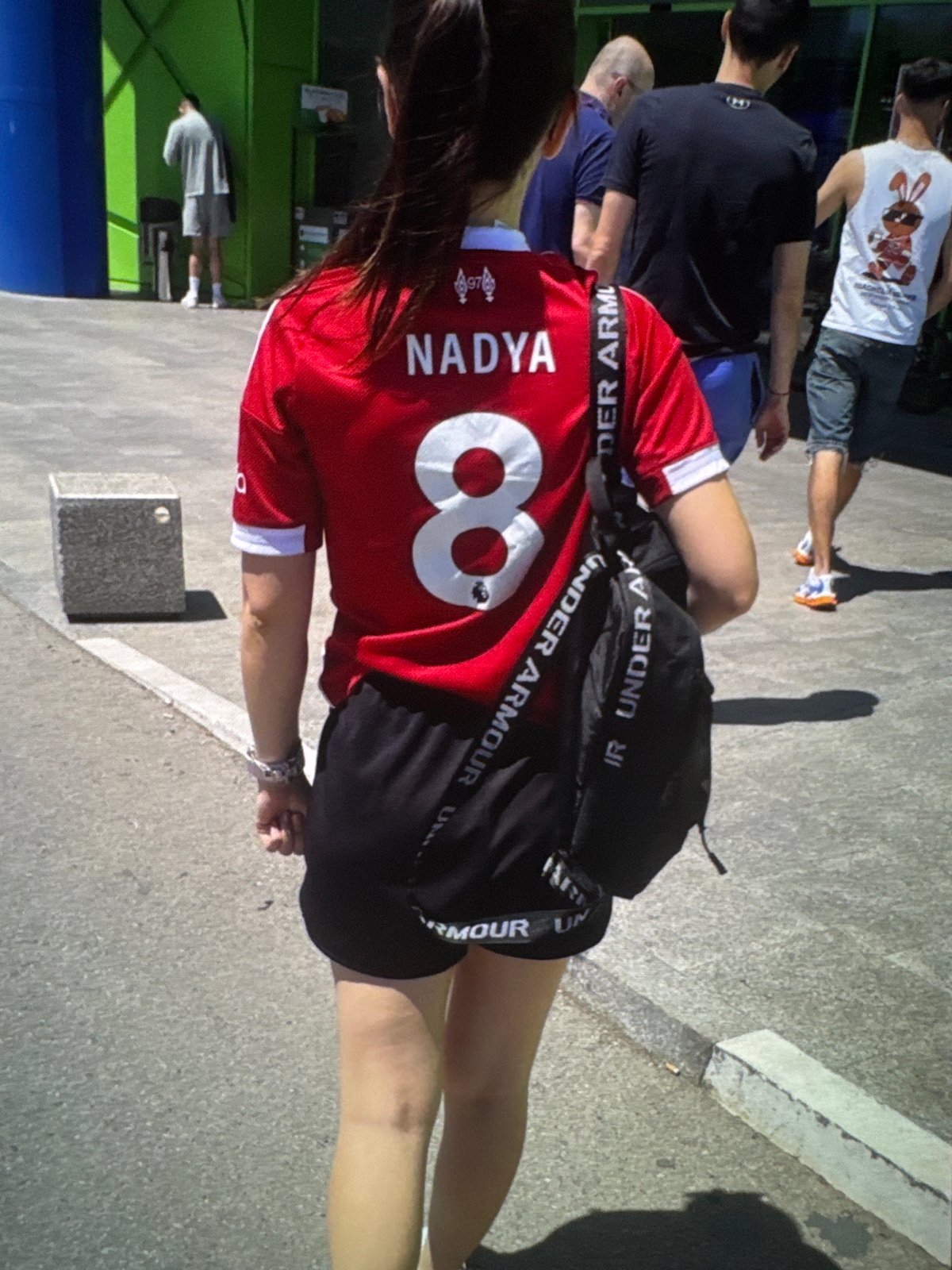 Soccer match viewing with beer and team jerseys