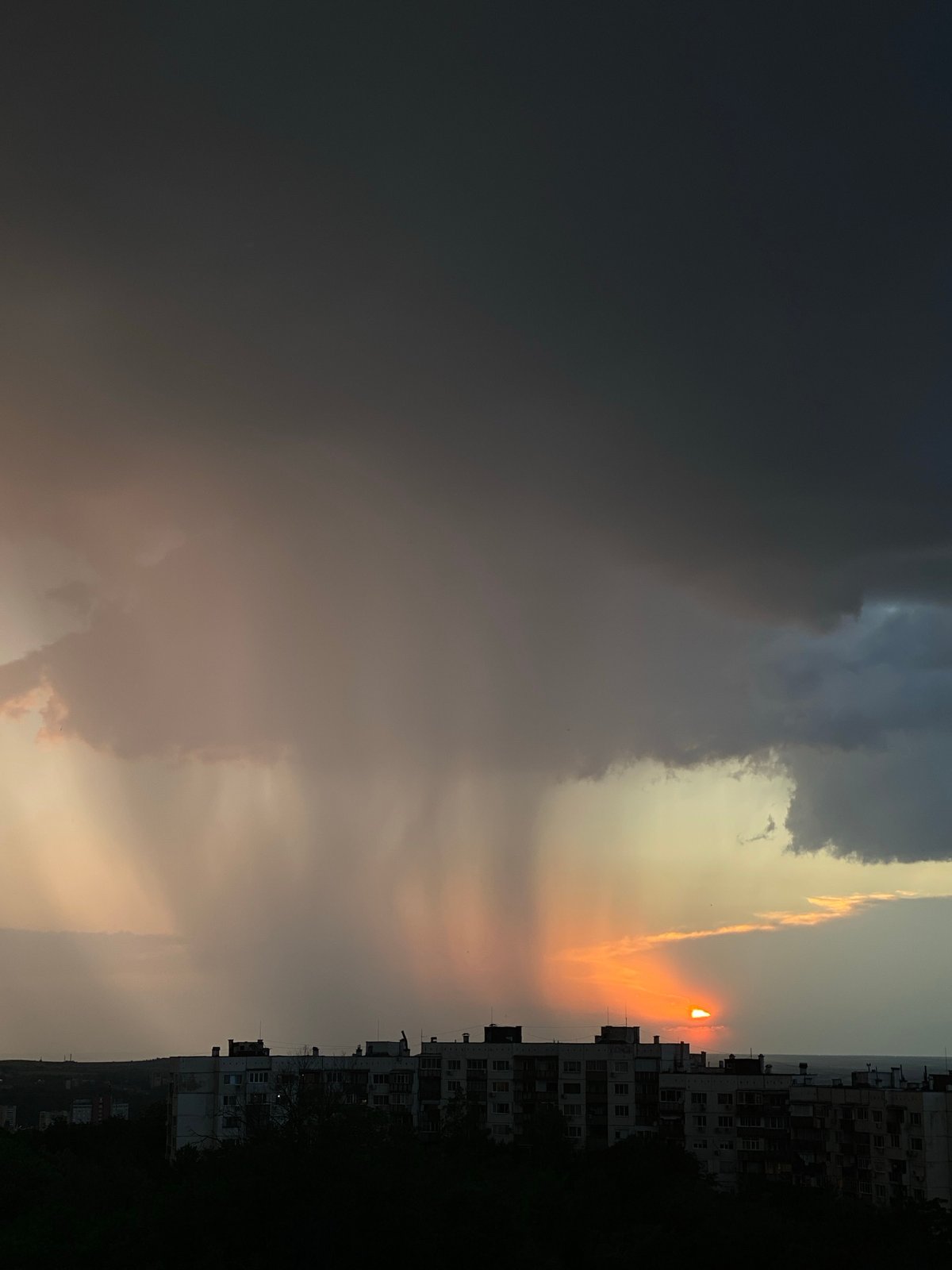 Sunset observed through storm clouds in Pleven, Bulgaria