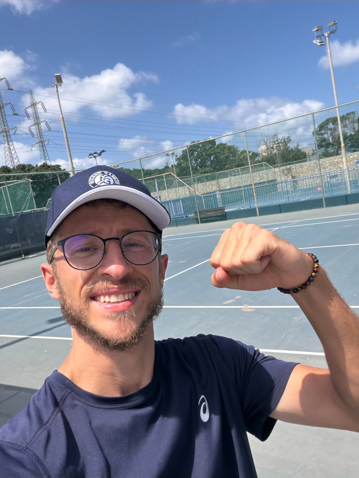 Morning tennis session on a blue court in Tel Aviv