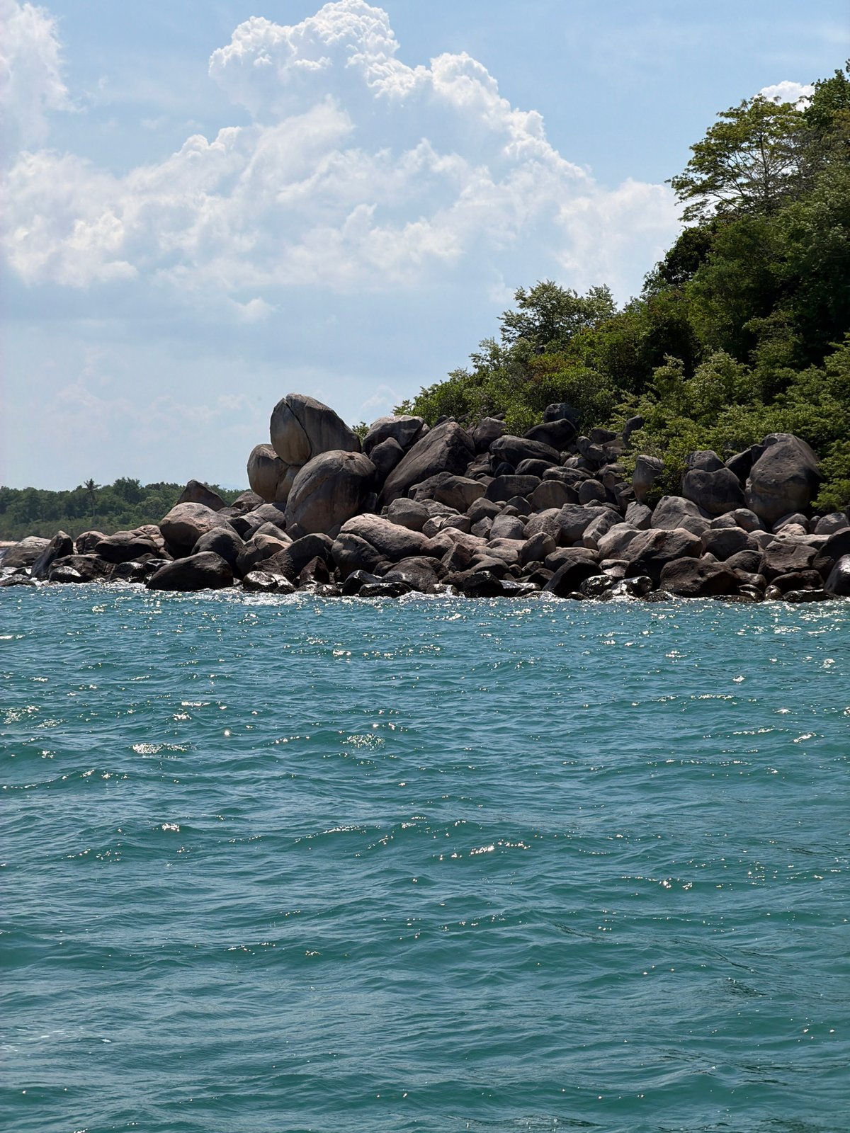 Nha Trang's rocky coastline and turquoise water, morning light
