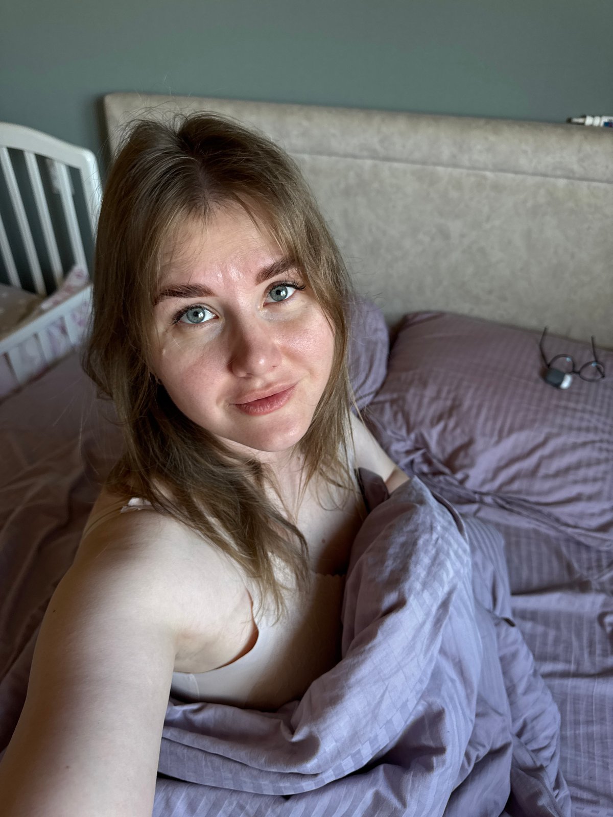 Mother and child share quiet morning moment in Russian home