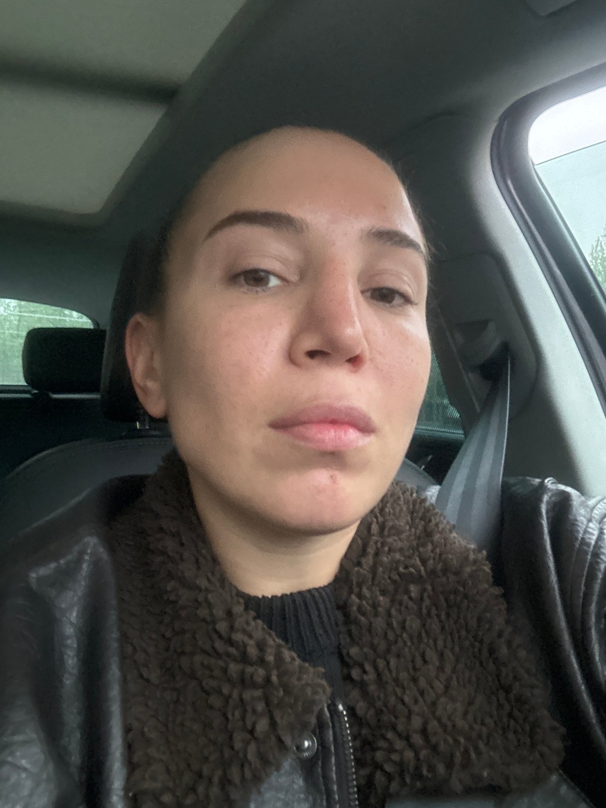 Woman in dark jacket observed in vehicle in Moscow