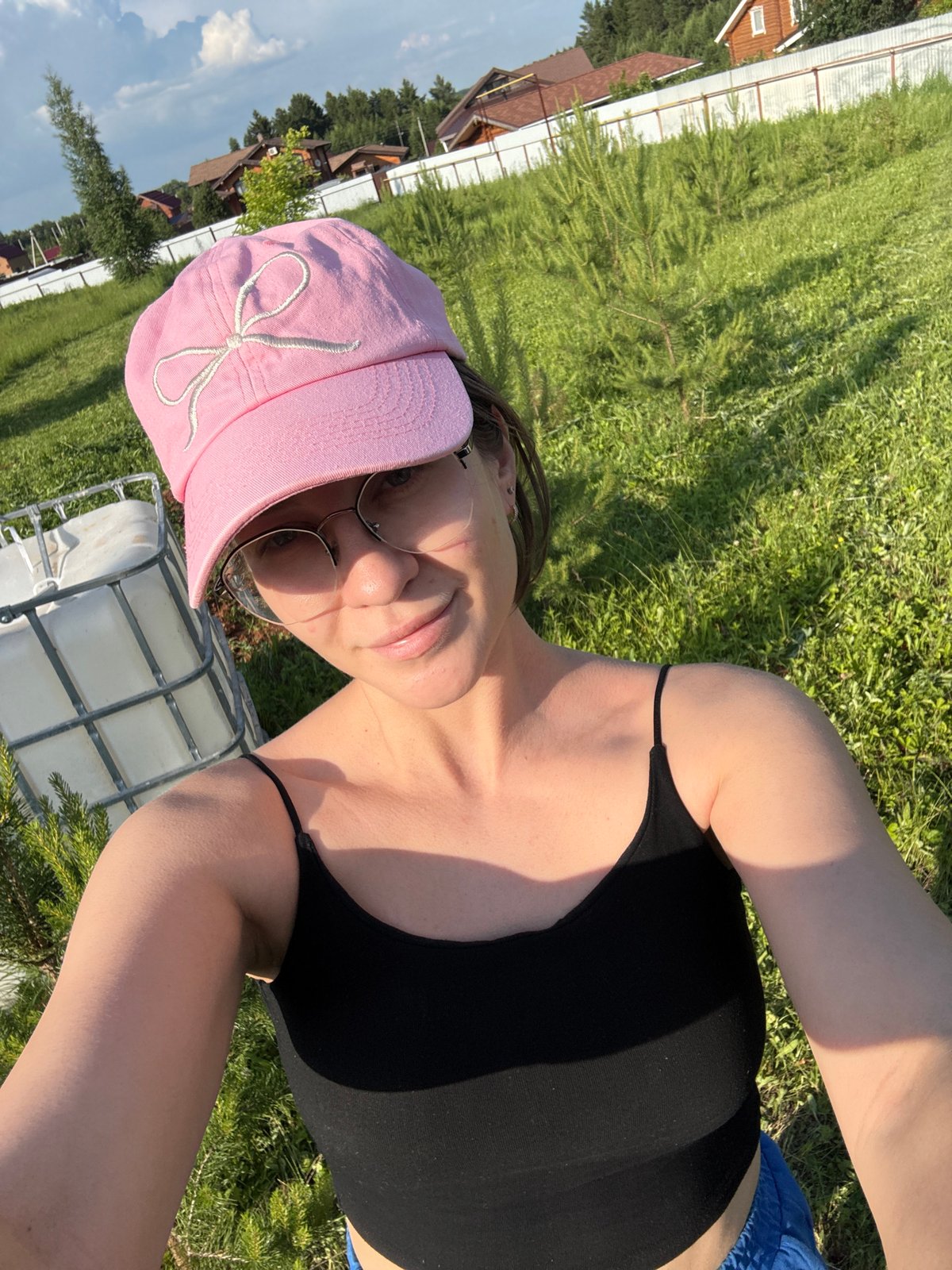 Woman documents outdoor selfie session with nature photography in Russia