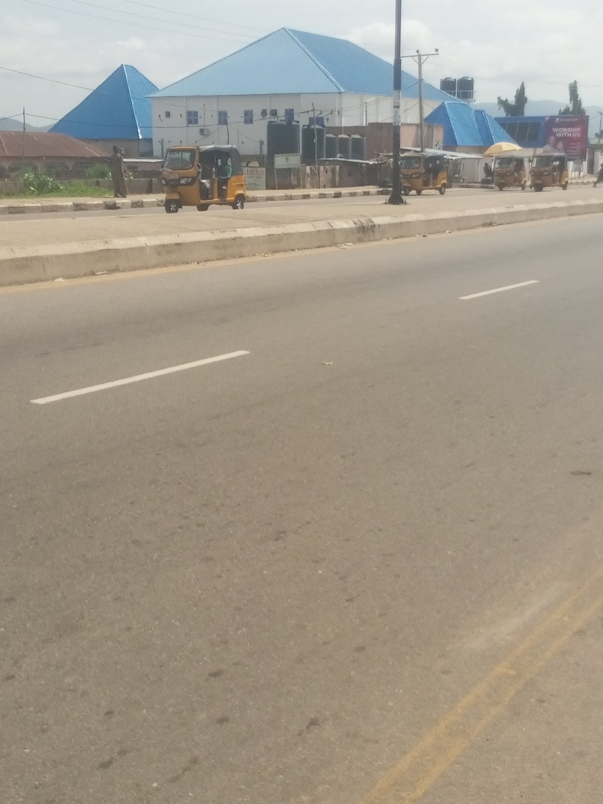 Everyday street life along a busy Jalingo road