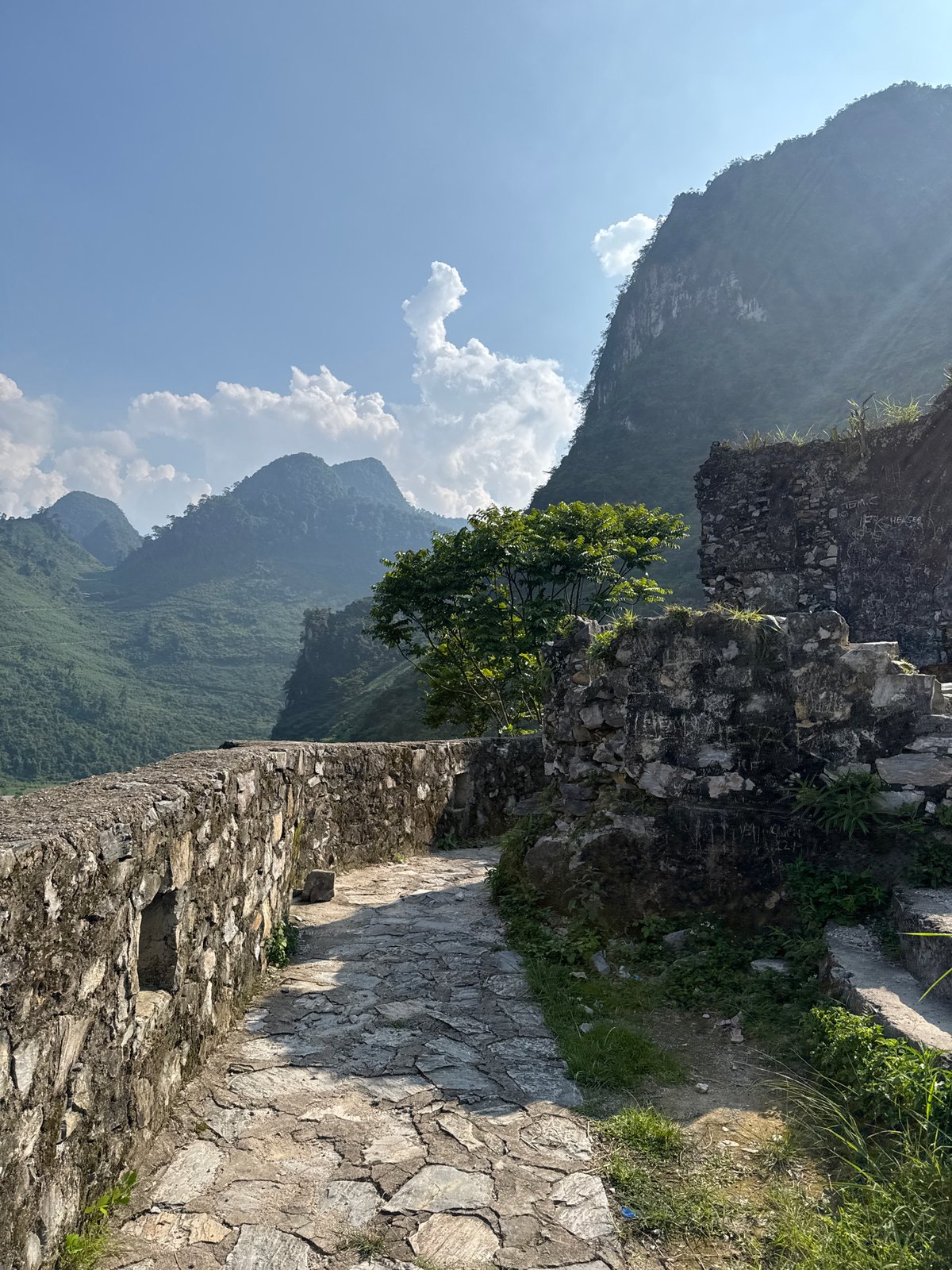 Tourists explore ancient ruins in Vietnamese mountain commune