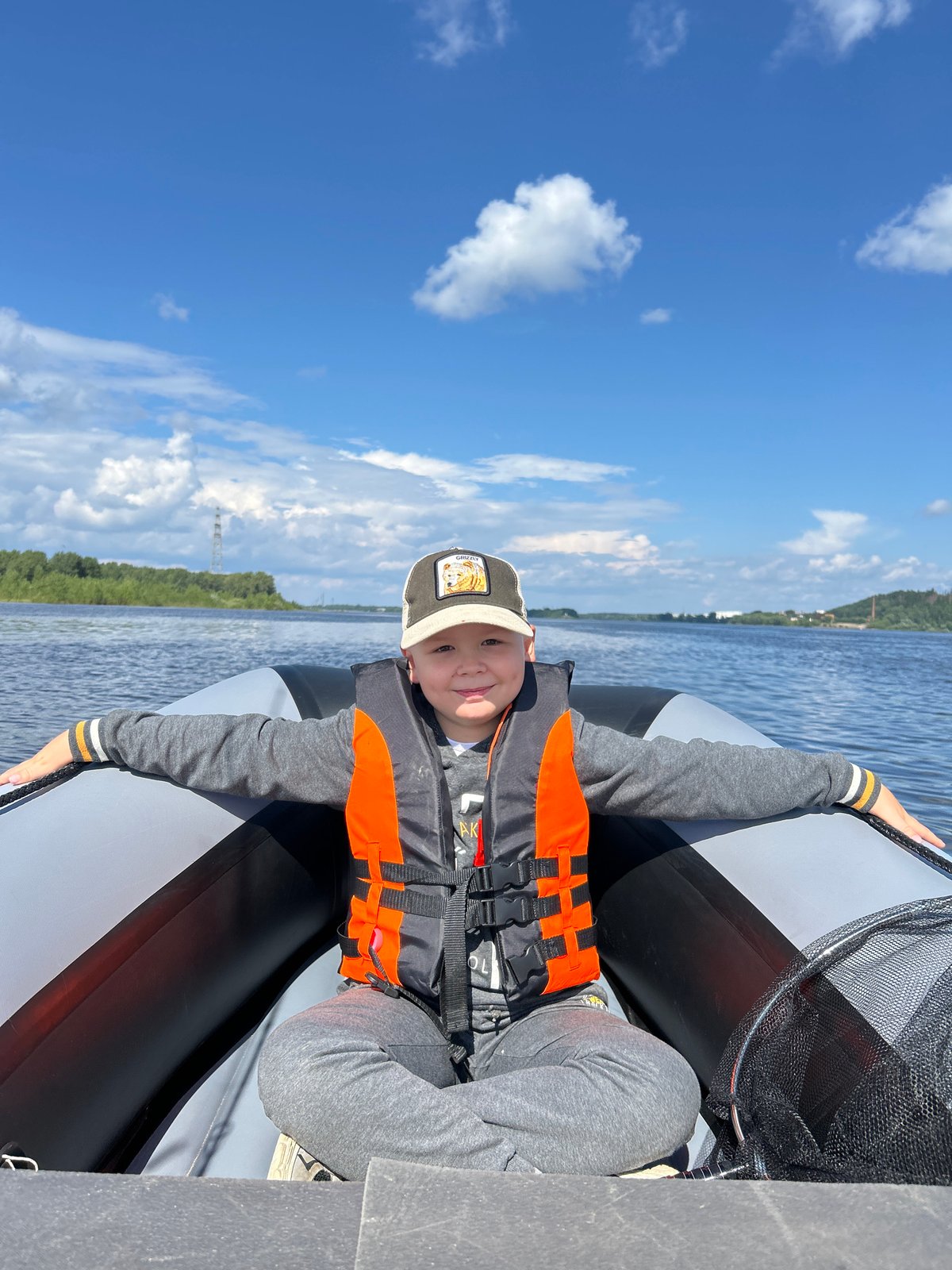 Summer day on the river: boats, forests, and a ski jump