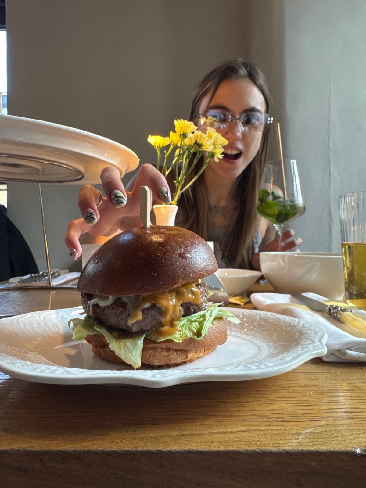 Woman enjoys gourmet meal at Moscow restaurant