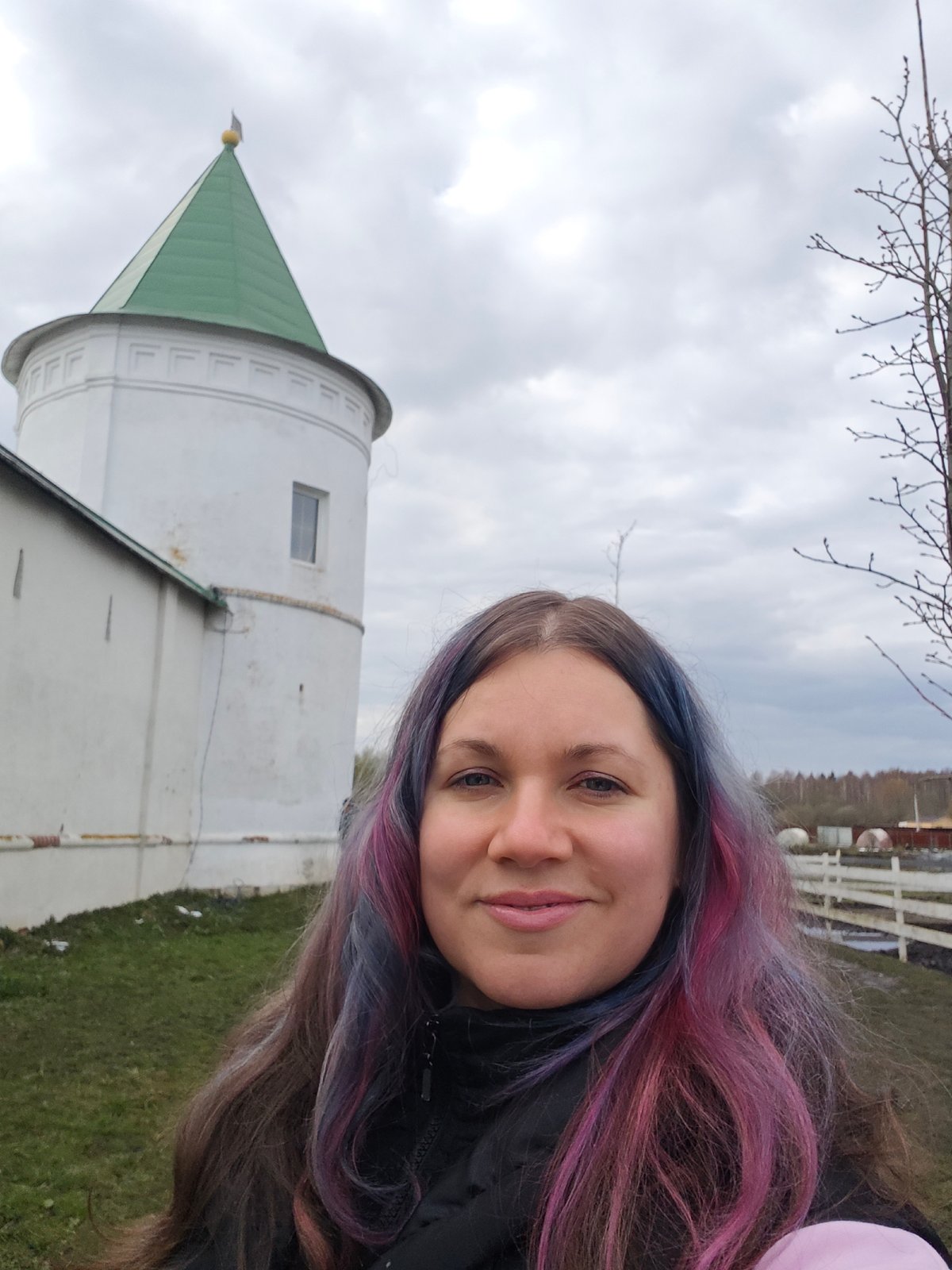 Visitor documents animals and architecture at Russian monastery site