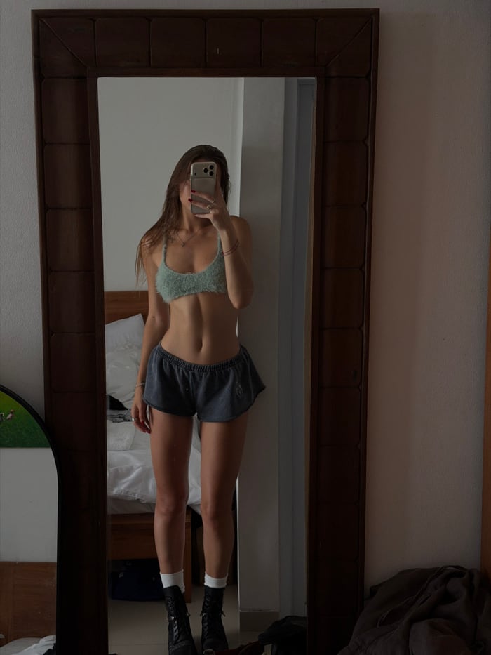 Woman Takes Mirror Selfie in Tibubeneng, Indonesia