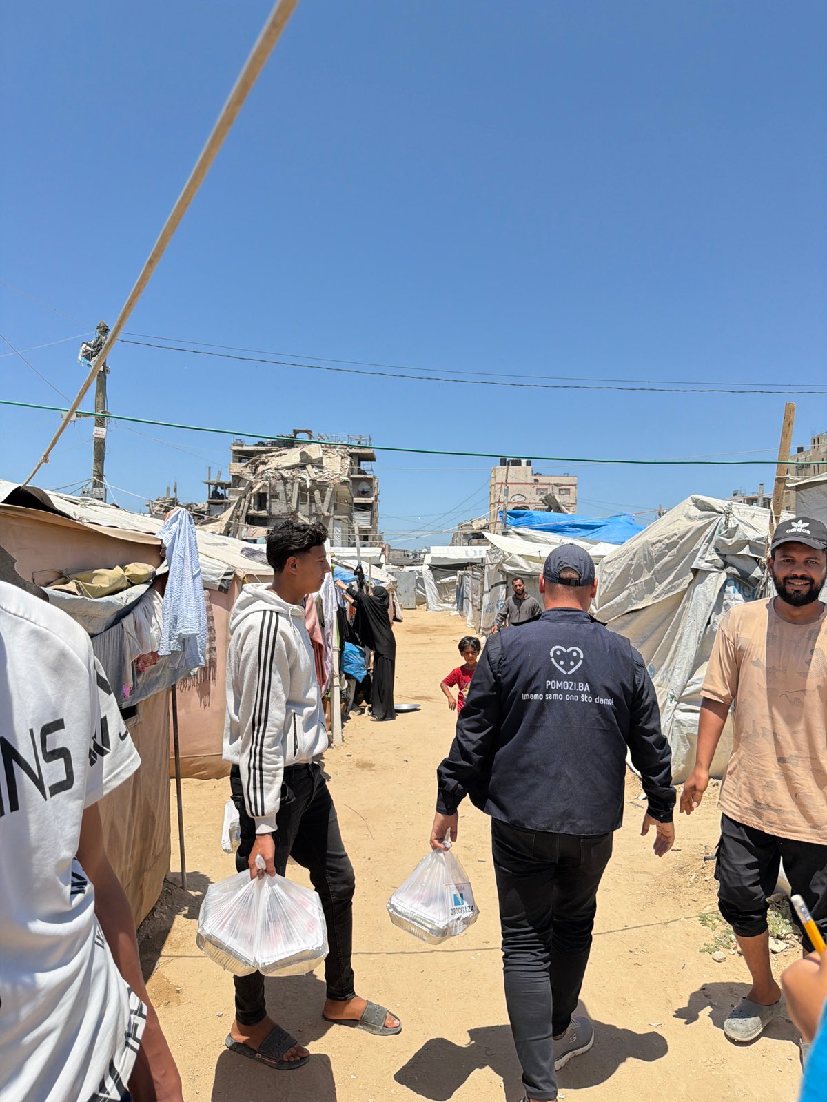 Makeshift shelters and damaged buildings documented in Gaza City