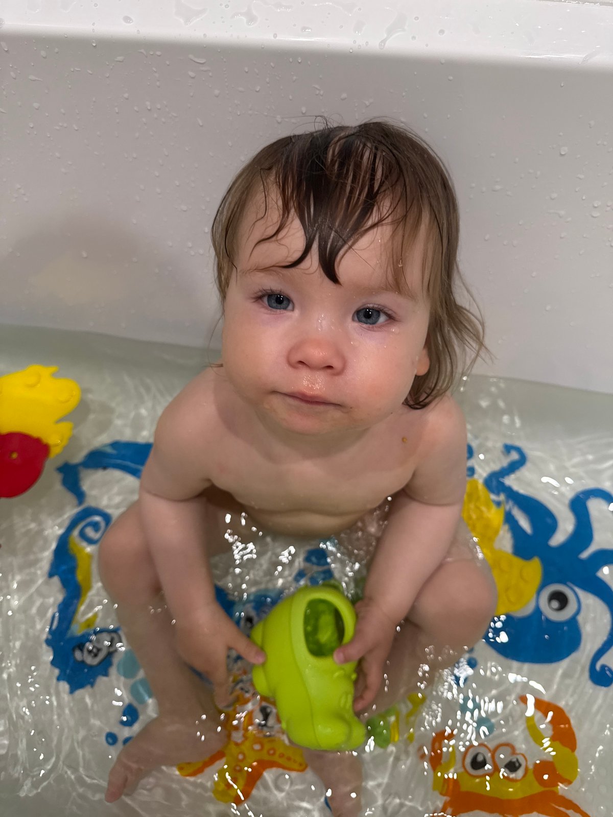 Moscow mother documents toddler's bath time in tiled bathroom