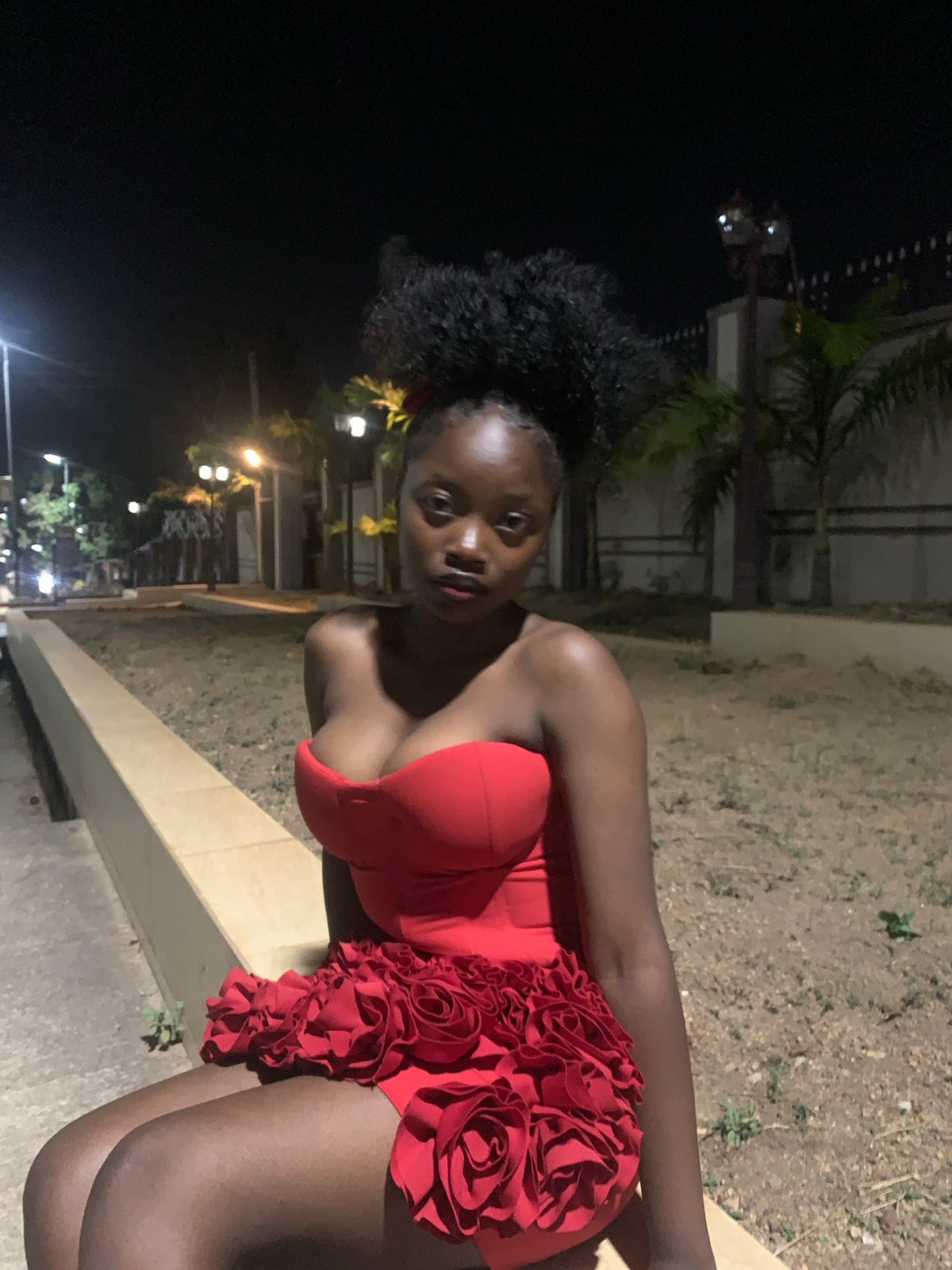 Evening fashion photoshoot captures women in colorful dresses in Jos