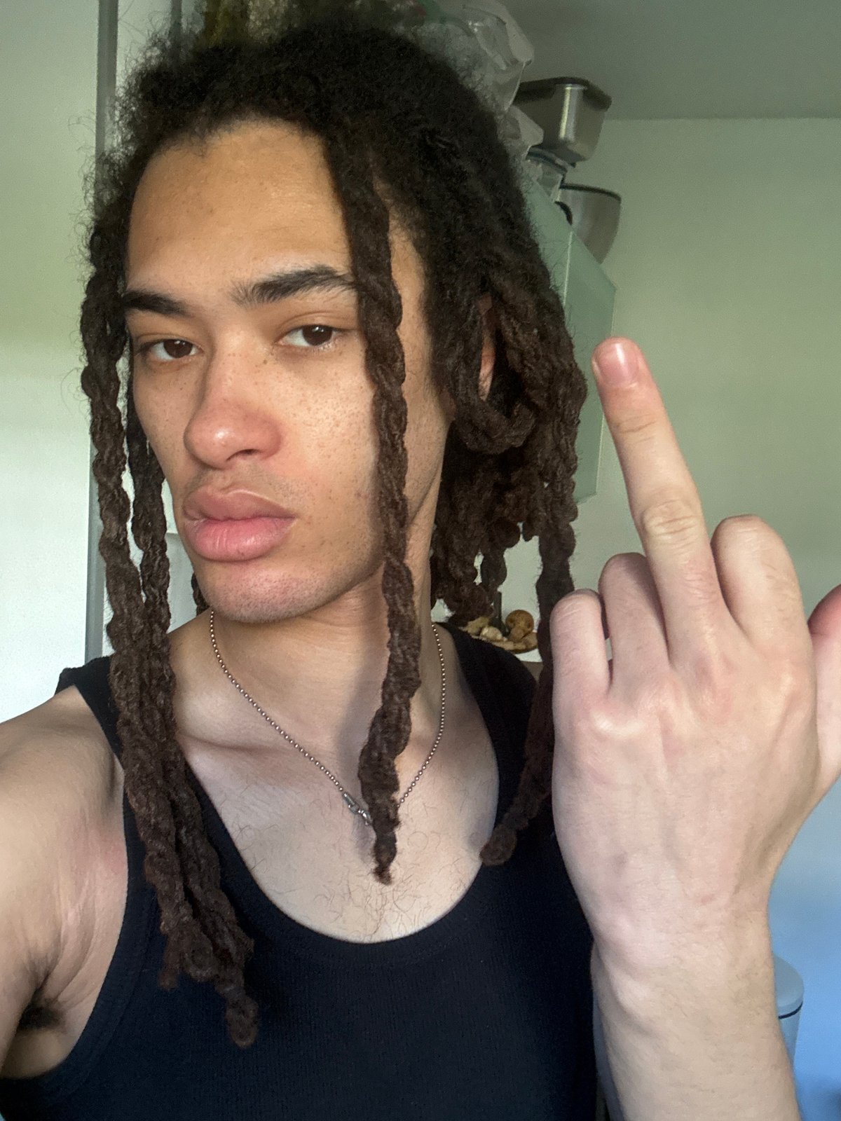 Person photographs selfies in Les Ulis park setting