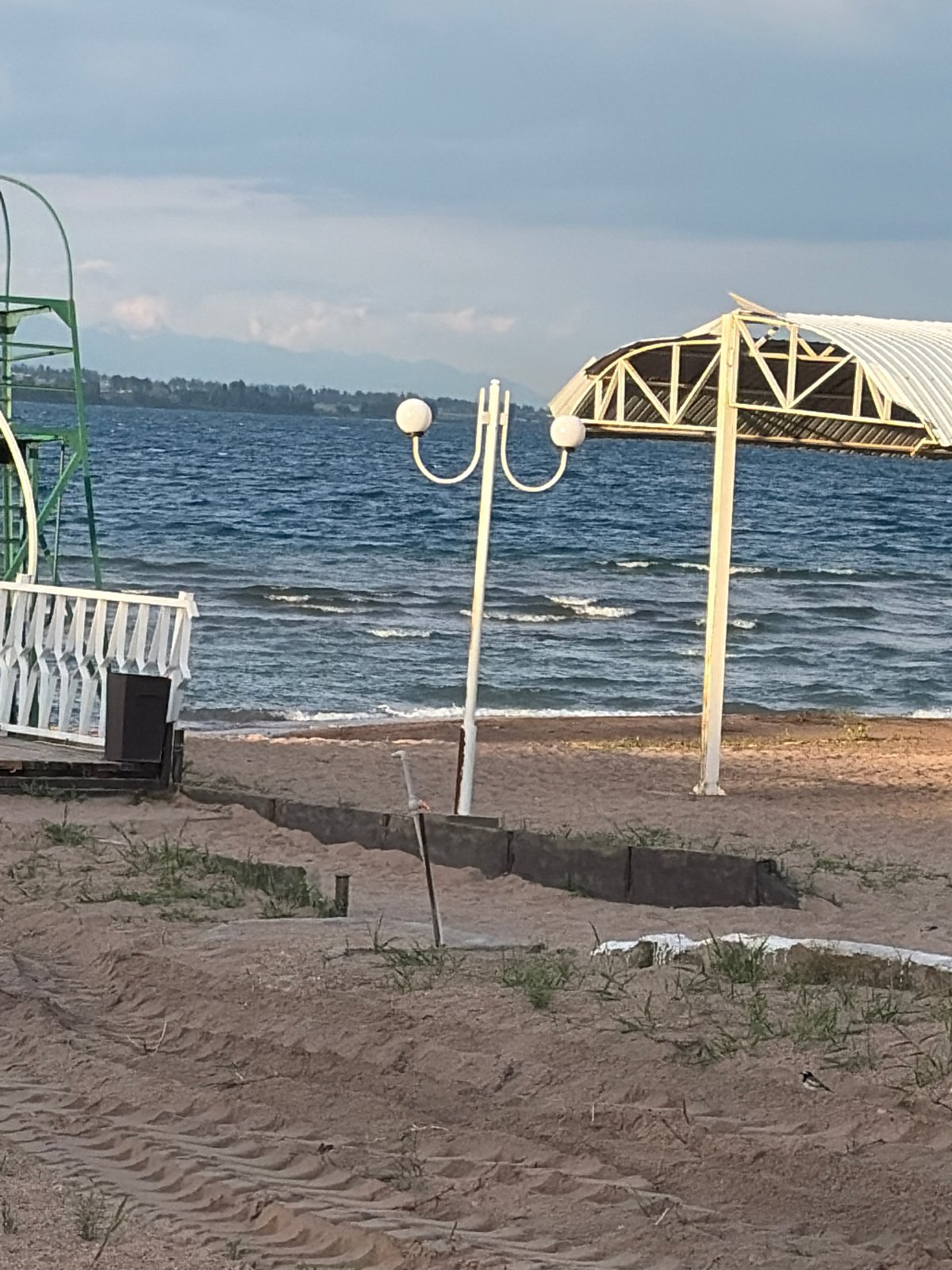 Overcast afternoon at a pier, roses and coastal views