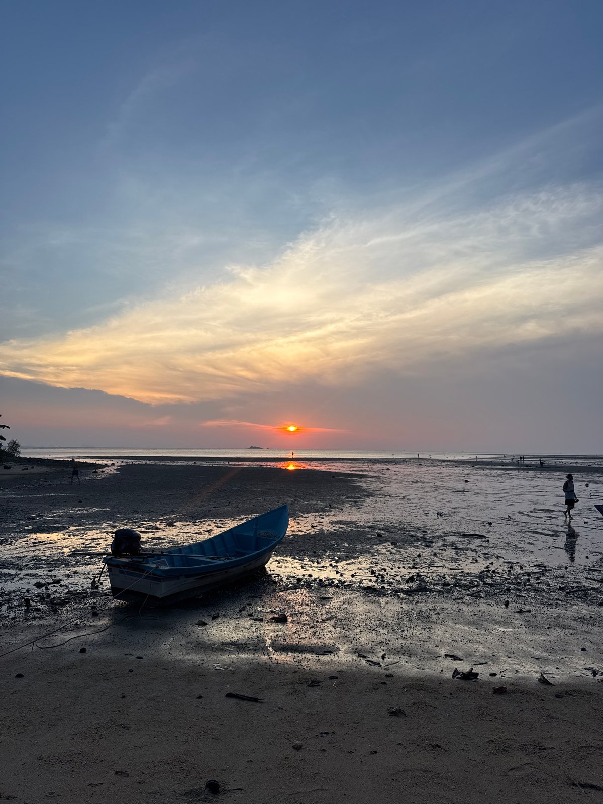 Sunset fishing boats documented at Thai coastal village