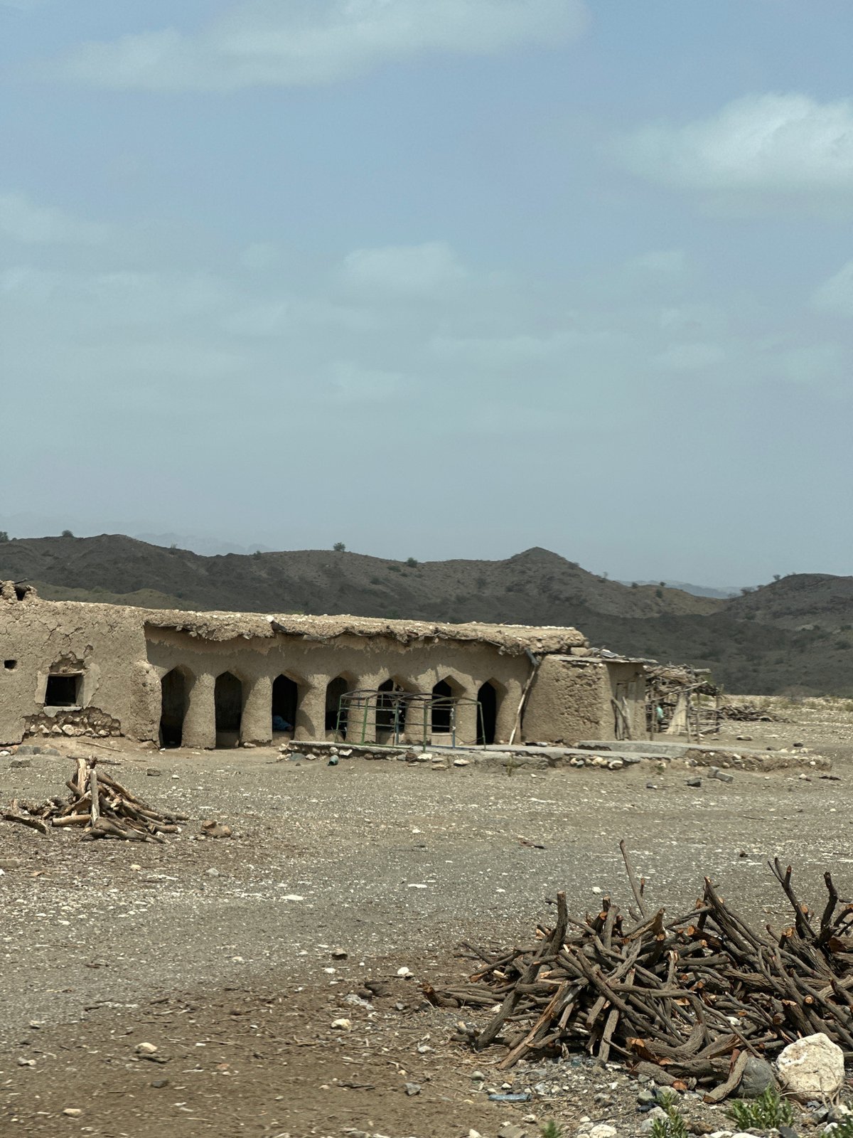 Crumbling mud-brick ruin in arid hills near Nimmi, Pakistan