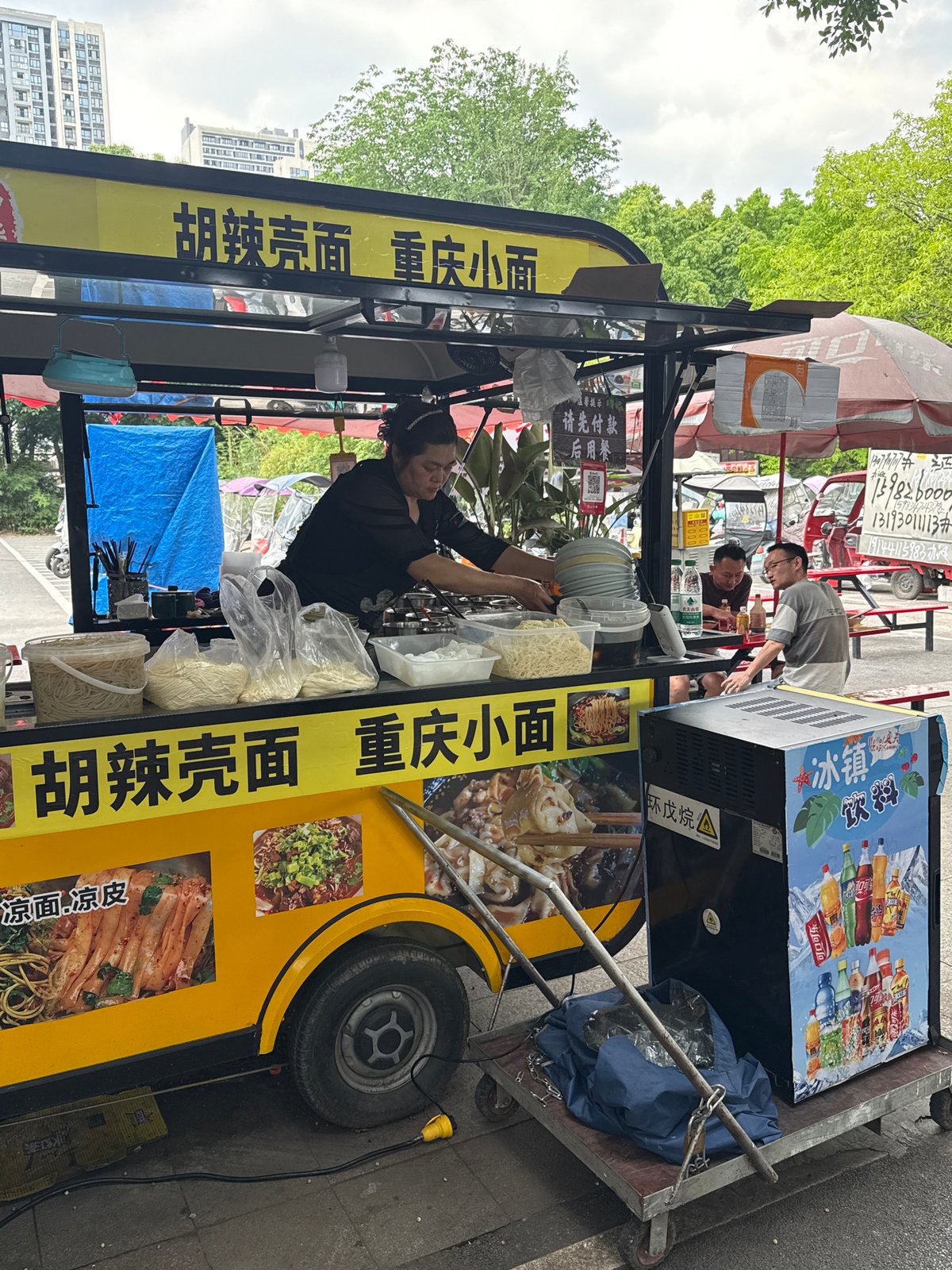 Early morning street vendors, workers active in Chongqing district