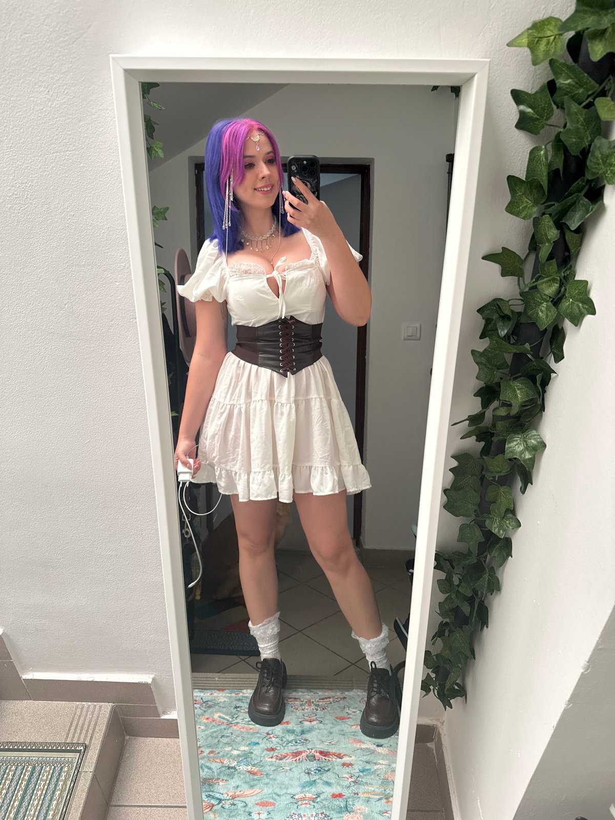 Woman takes mirror selfie in colorful outfit in Zagreb
