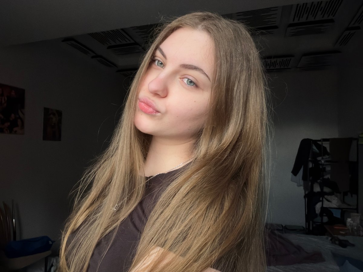 Close-up portrait look, neutral expression, Dnipro