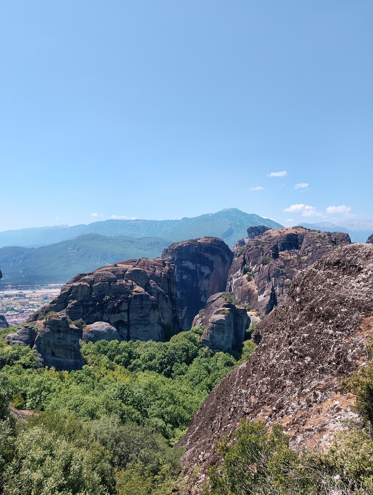 Meteora's rock pinnacles and cliff-top monasteries on a clear morning