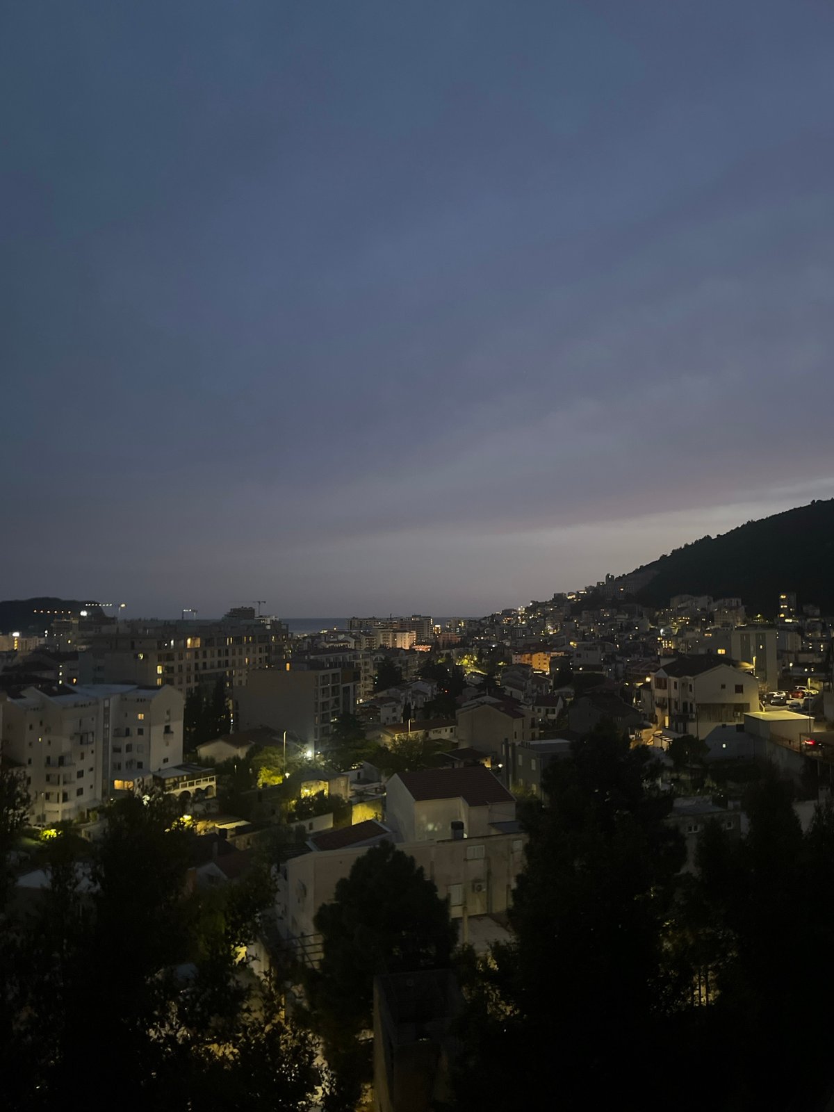 Nighttime view captured of Budva Montenegro coastal cityscape