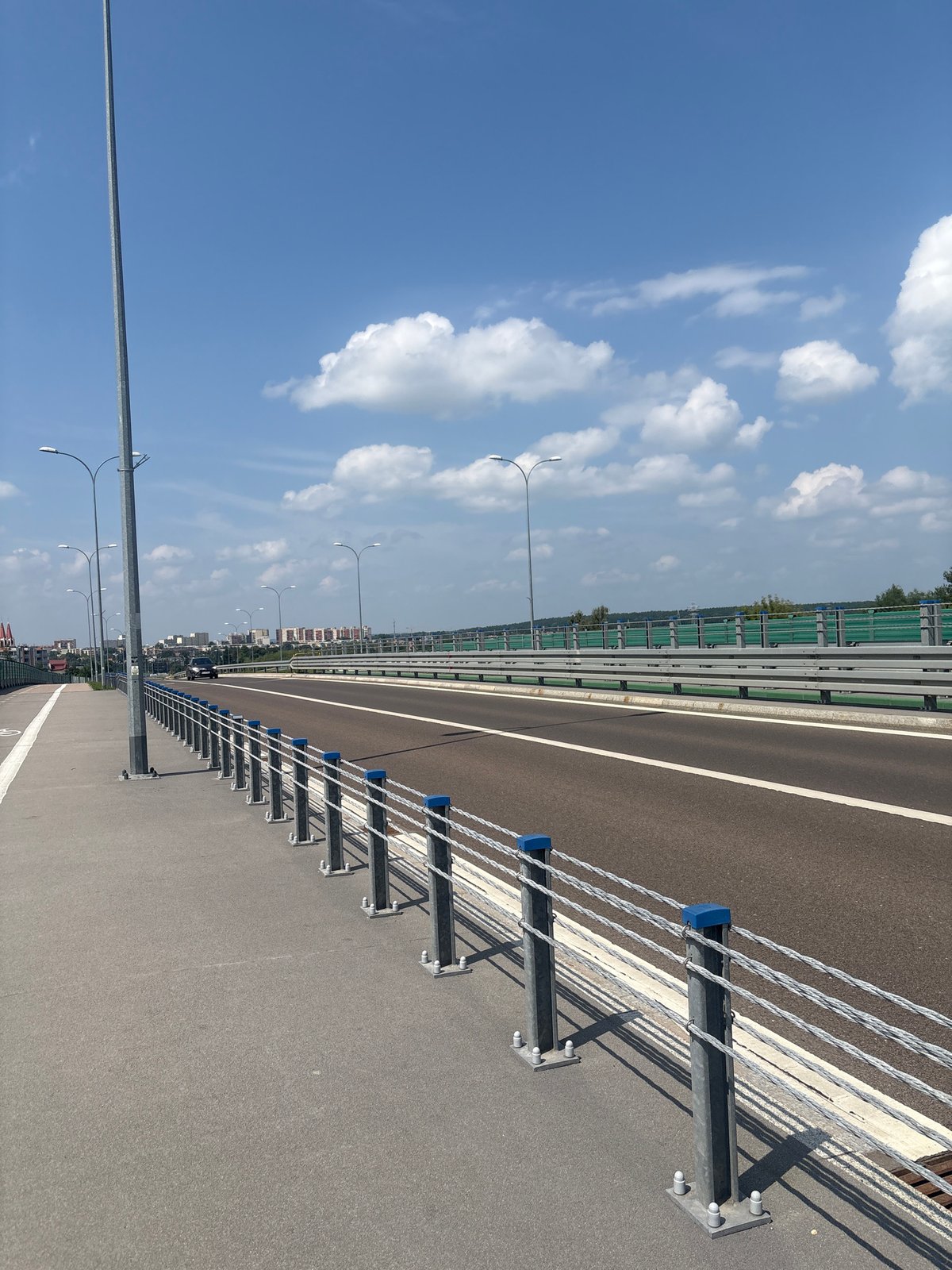 Walking a bridge path on a clear sunny day