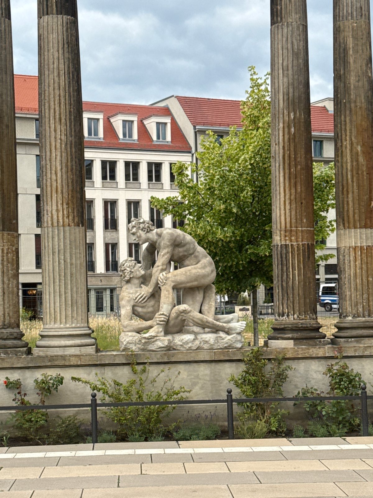 Tourist documents Potsdam's neoclassical architecture during brief city visit