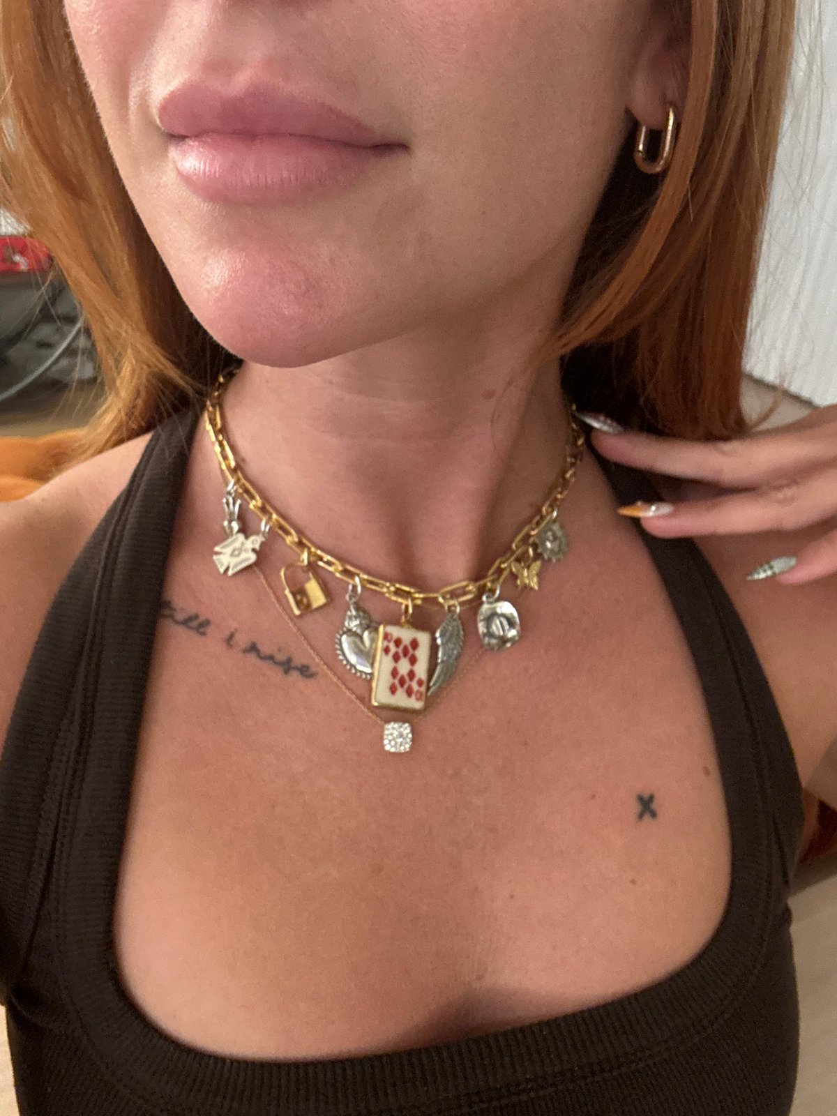 Person in gold chain photographed in close-up portrait