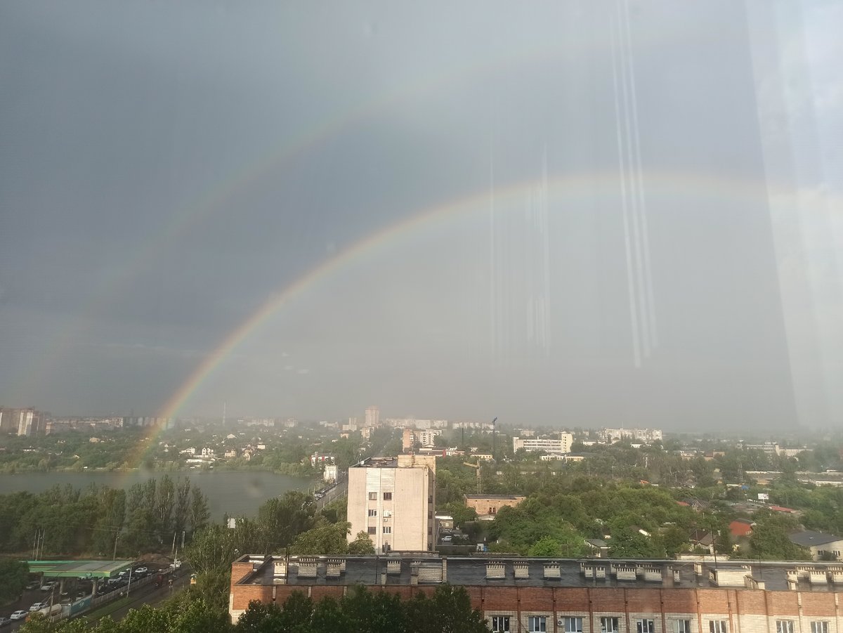 Double rainbow over the city, plus a nearby indoor event