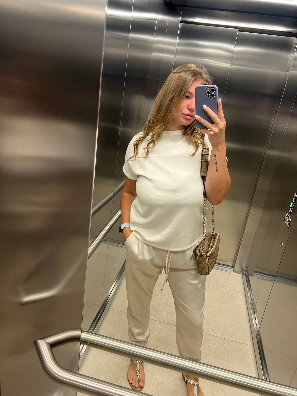 Woman takes elevator selfies in Budva Montenegro morning