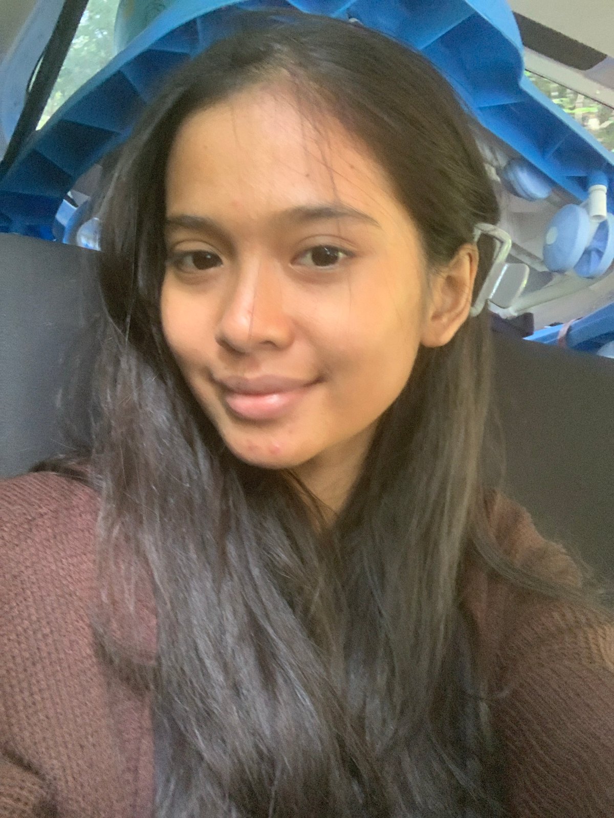 Woman photographed near medical equipment in early morning selfie