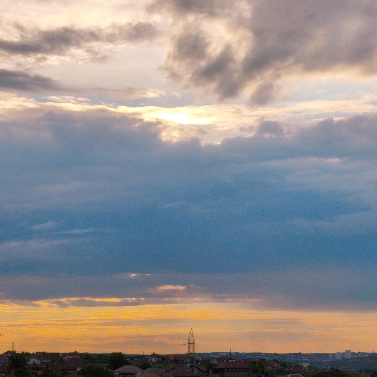 Stormy skies over a quiet town, plus chicken wings