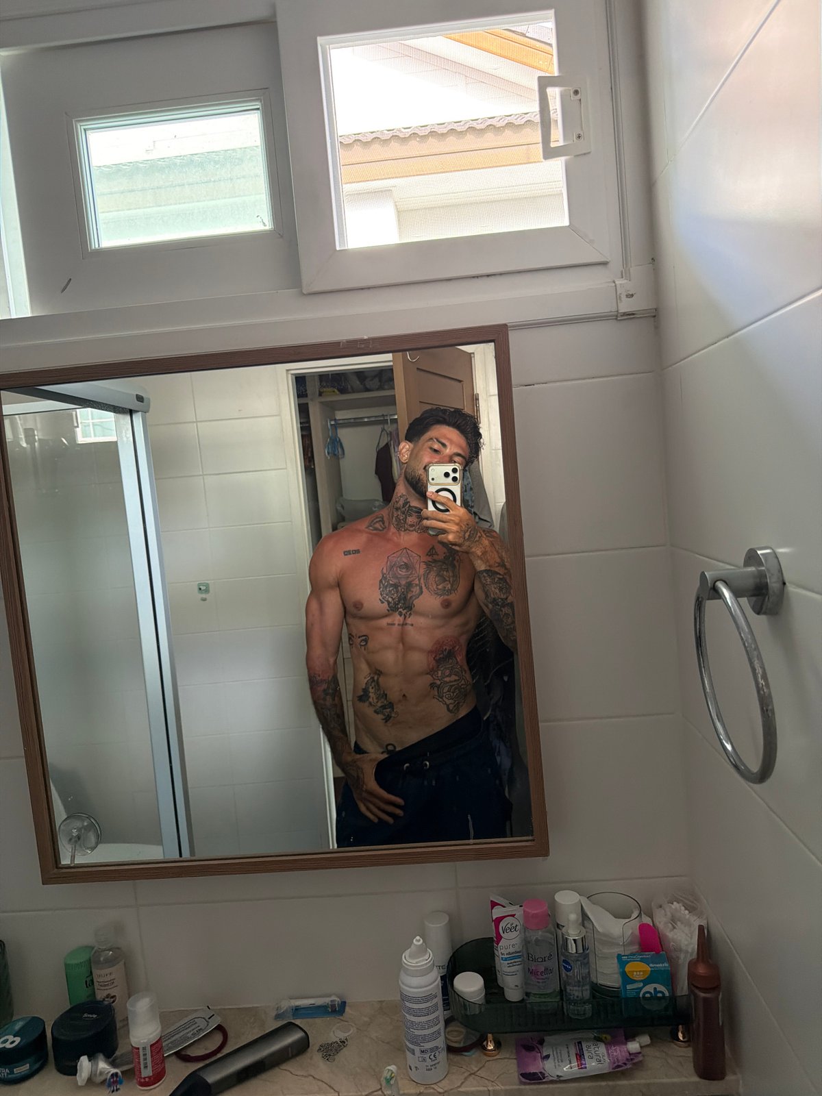Man takes bathroom mirror selfies in Chalong, Thailand