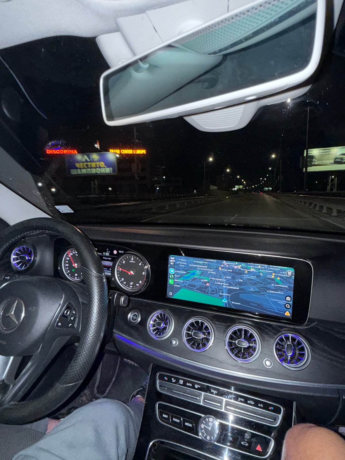 Night drive through Sofia captured via car navigation display