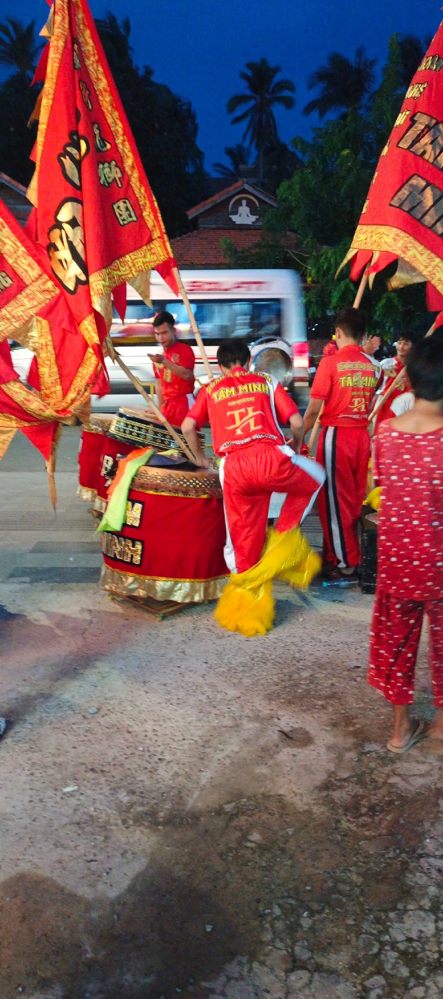 Traditional dragon dance performance captivates urban streets at dusk