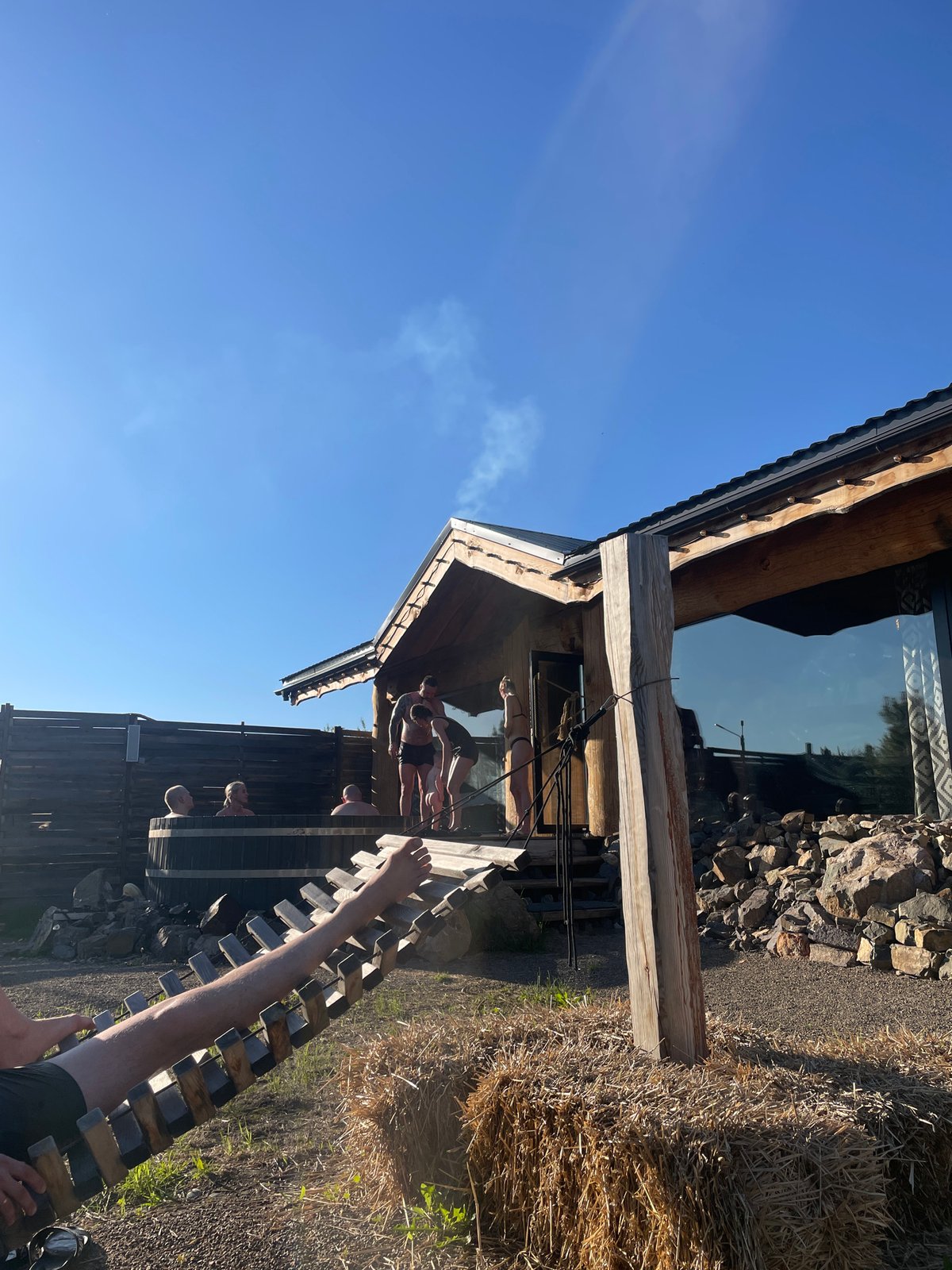 Social gathering at Siberian bathhouse features outdoor feast