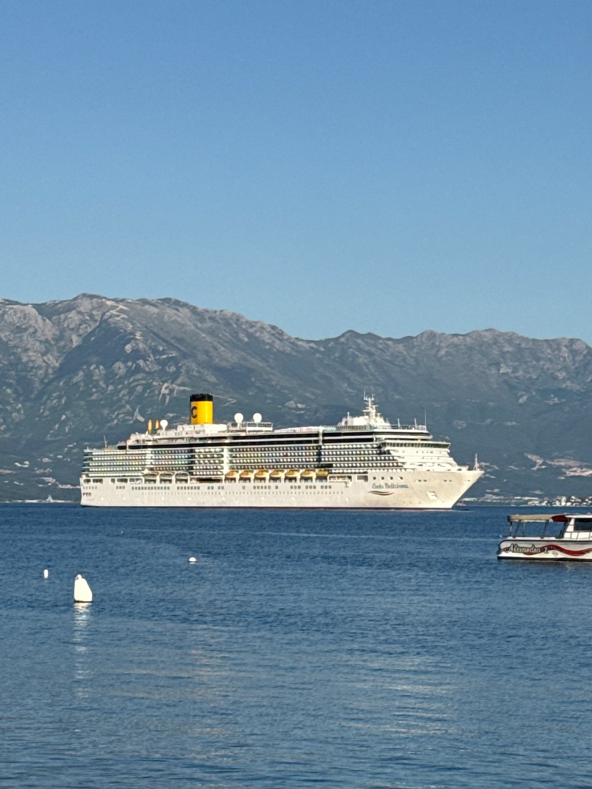 Costa Deliziosa cruise ship docks in Đenovići Montenegro harbor