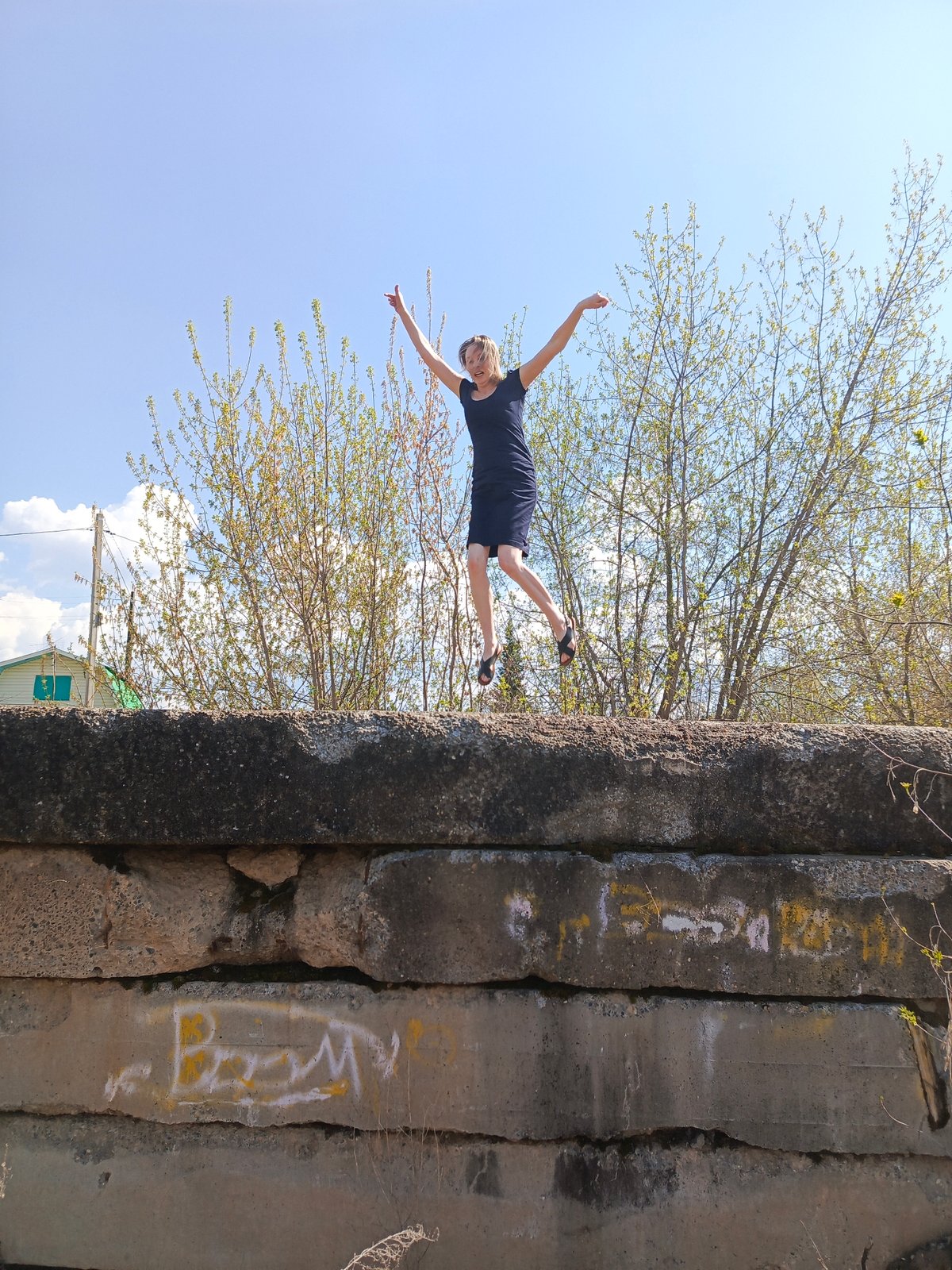 Woman photographed during riverside outing in Chaikovsky, Russia