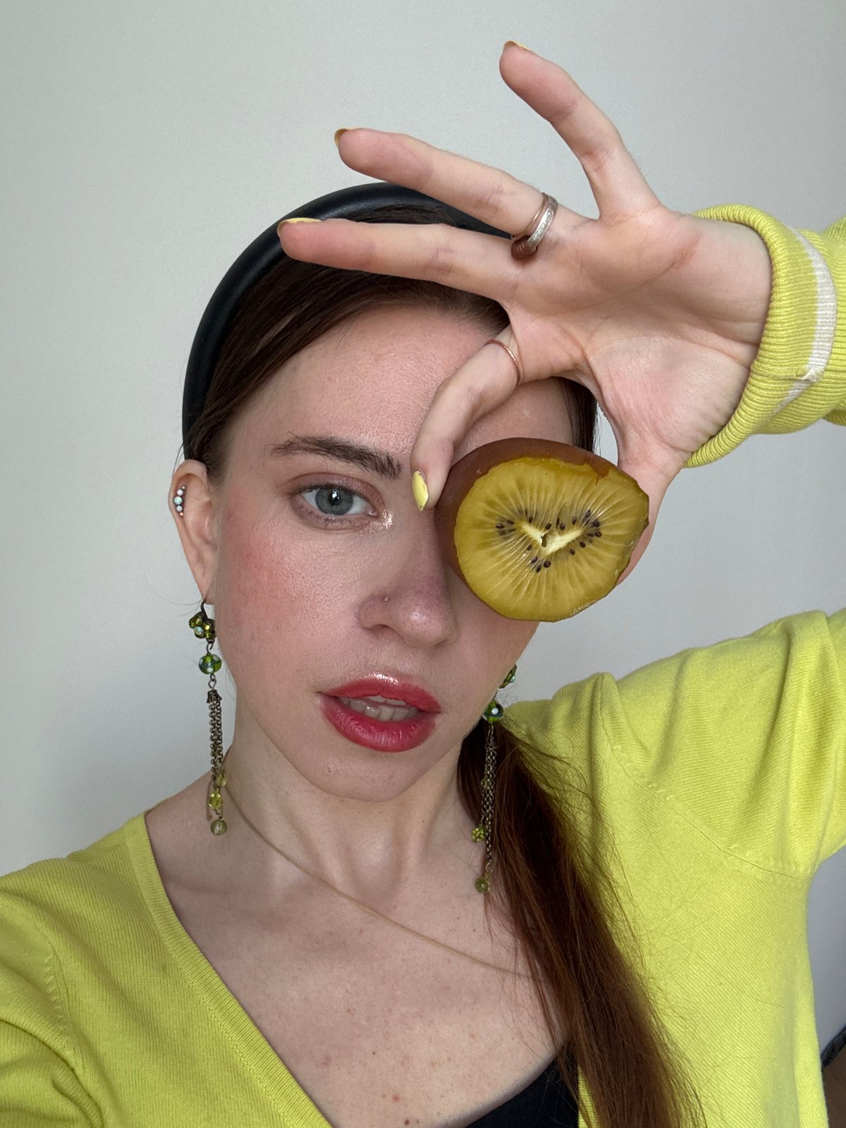 Woman poses with kiwi fruit in Moscow photo session