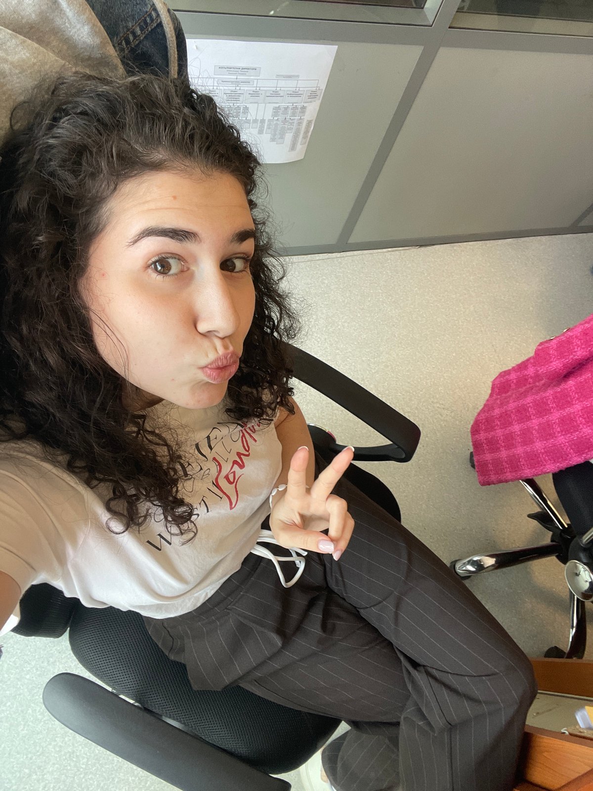 Woman documents morning office routine in Sofia with selfies