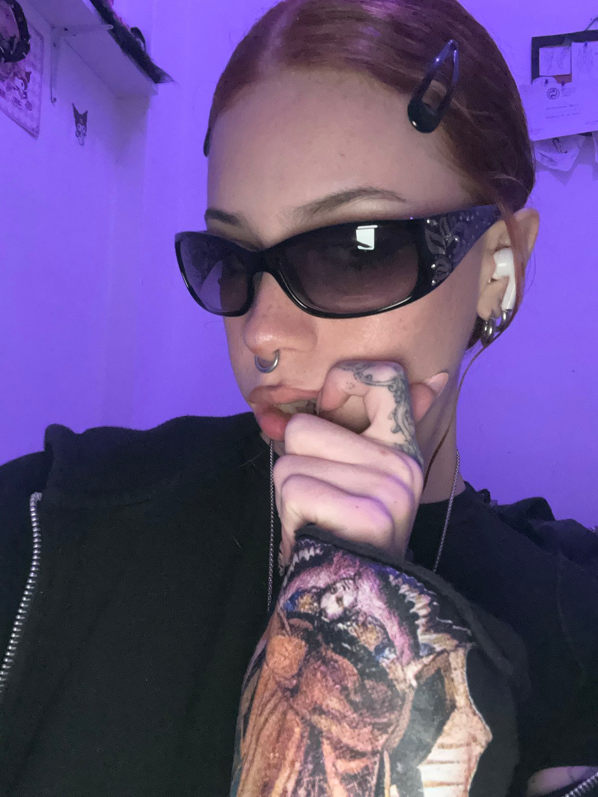 Young woman with piercings, tattoos observed in Buenos Aires