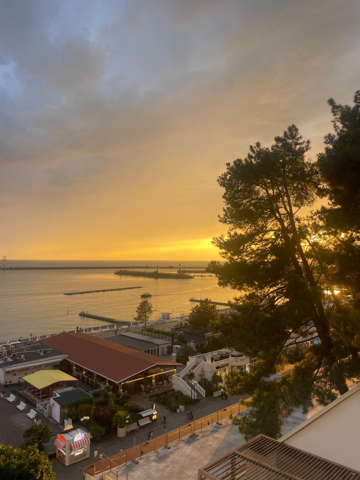 Tourists capture sunset moments in Sochi's coastal district
