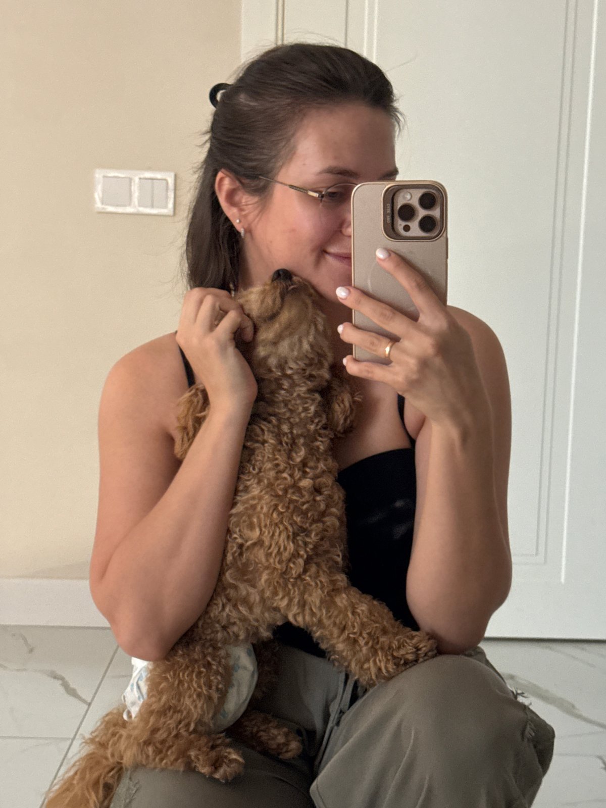 Woman documents morning routine with diapered poodle in Russia