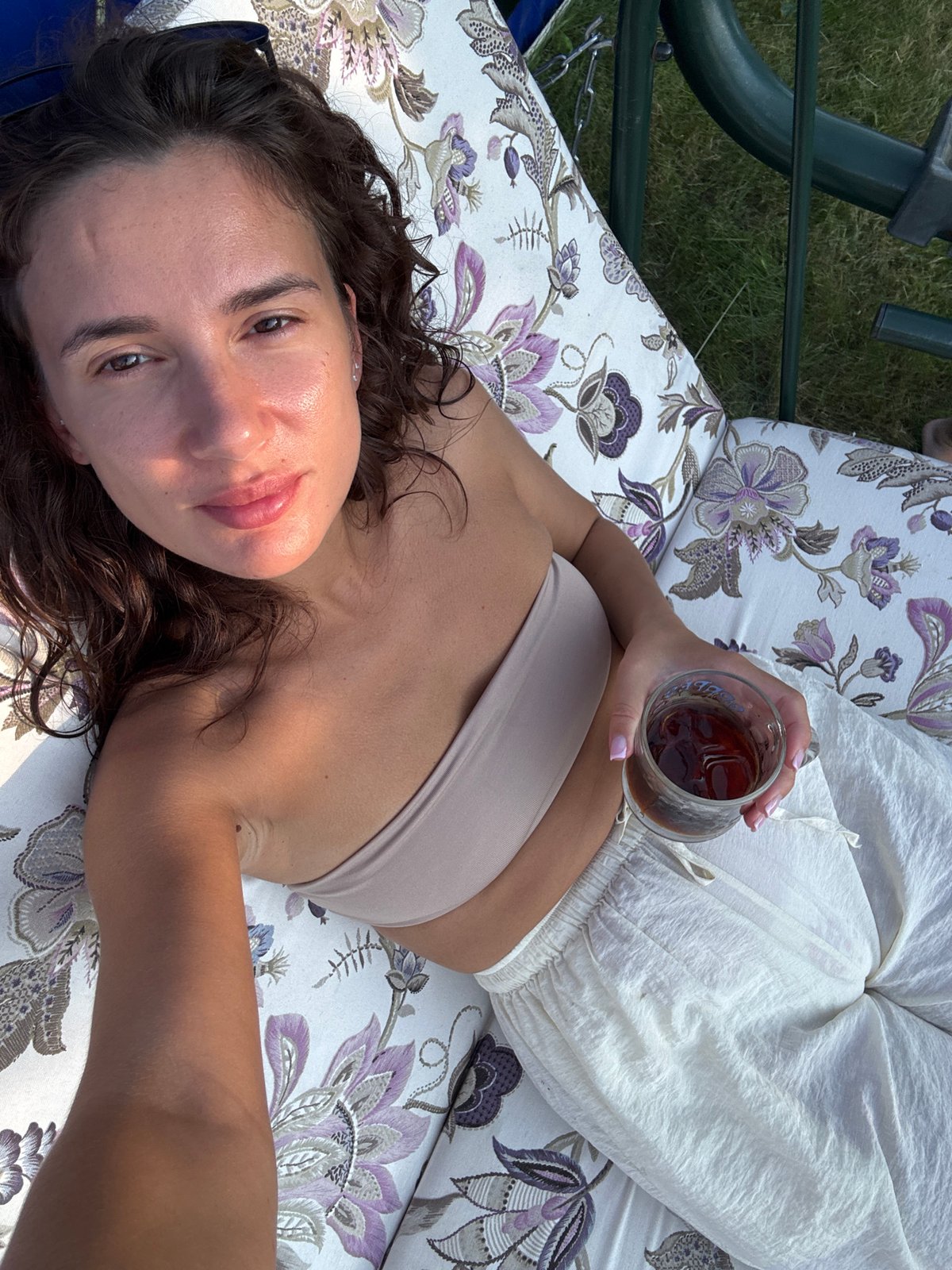 Lazy summer afternoon on a backyard swing in Chaikovsky