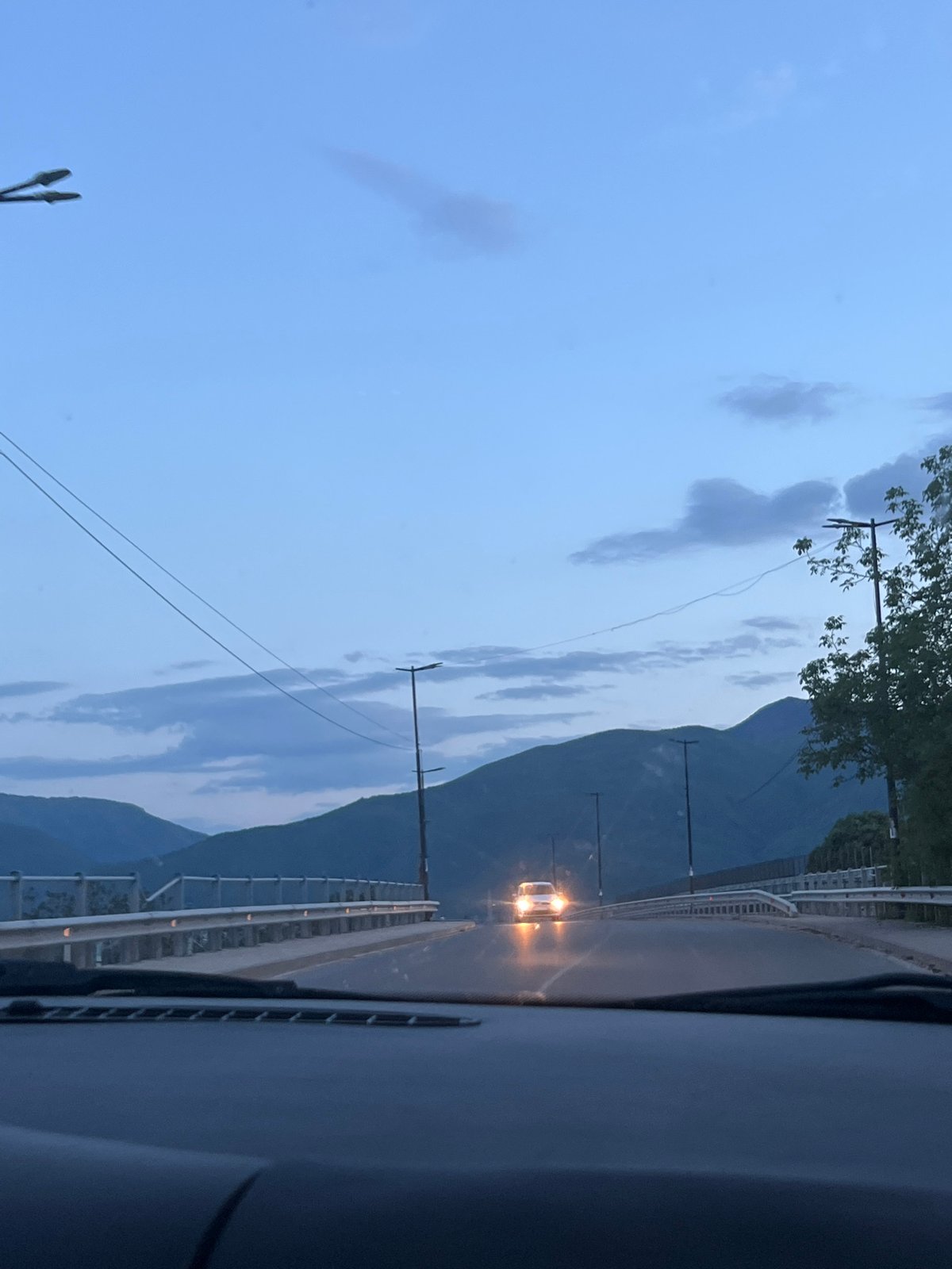Vehicle crosses bridge near Septemvri, Bulgaria at dusk