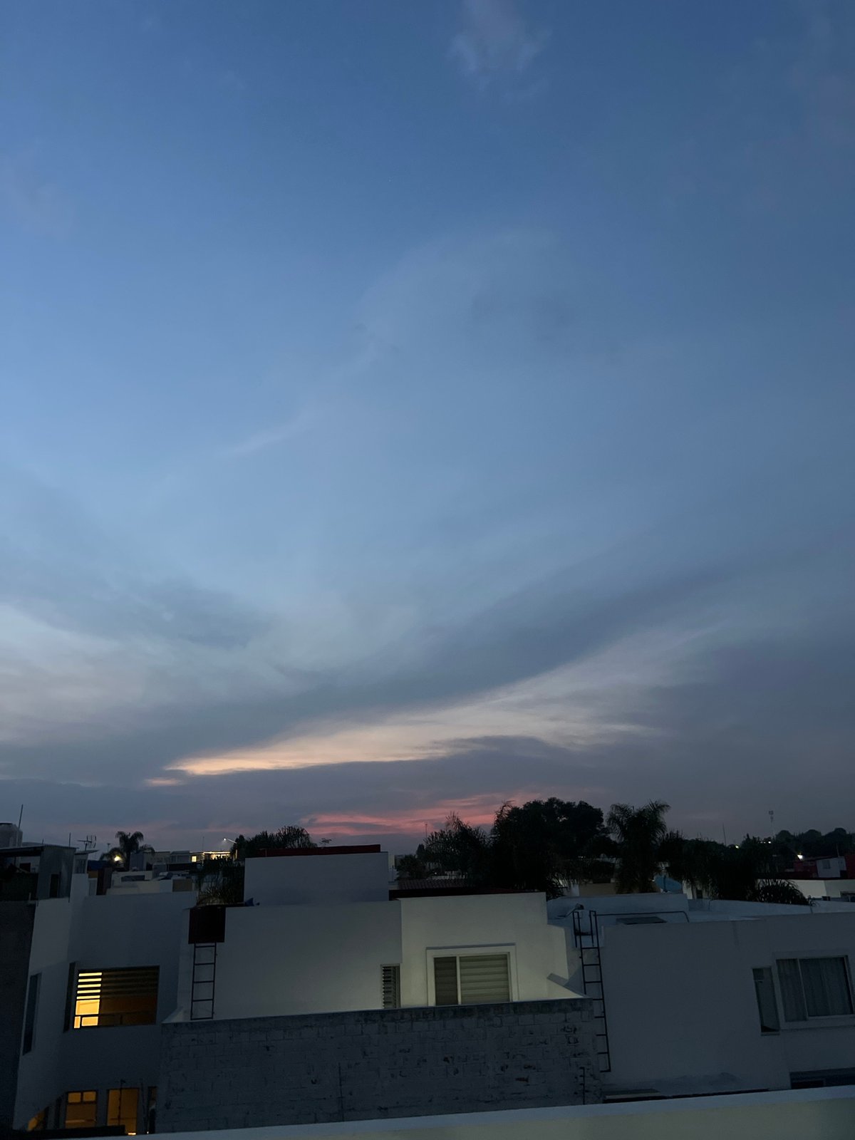 Twilight sky documented over Cholula, Mexico urban landscape