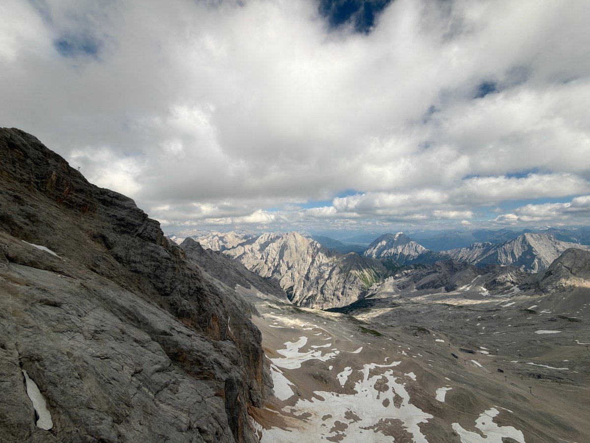High on the rocks above Garmisch, cloudy skies overhead