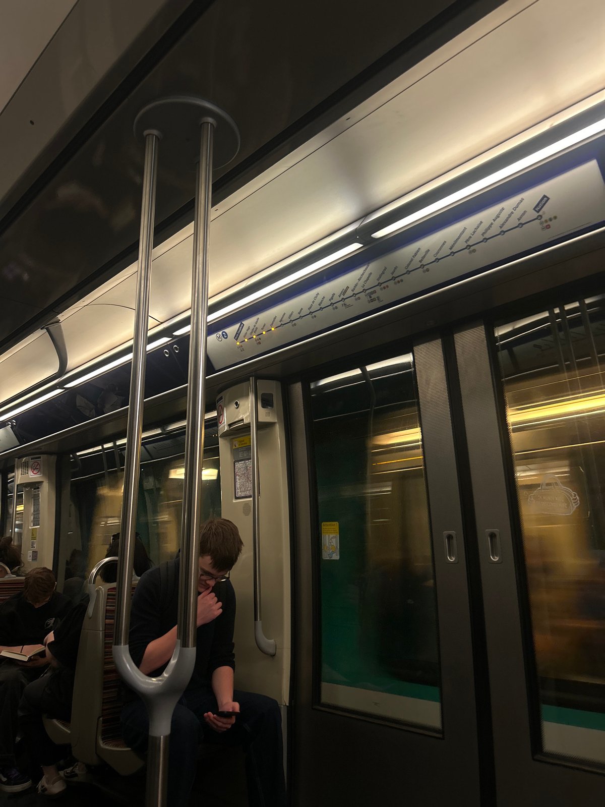 Routine passenger moments documented on Paris Metro train