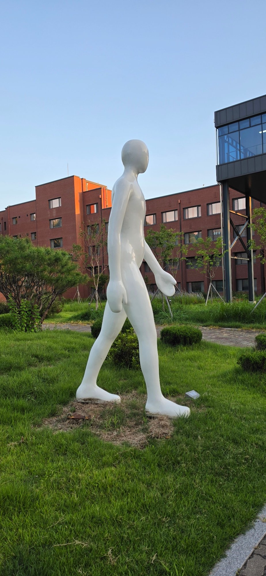 Strolling a sculpture-dotted campus in Cheongju at golden hour